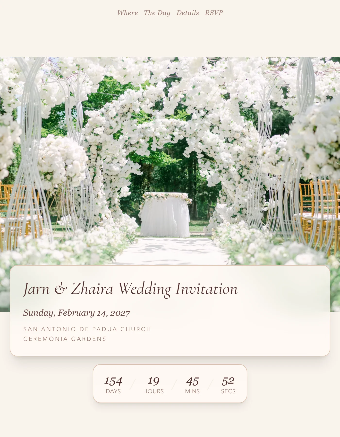 Romantic sample invitation: a white floral arch over a garden aisle, with the couple's names in italic script on a frosted card below